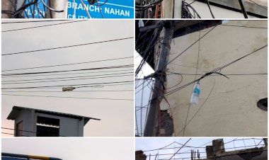 ऐसे लटकाई जा रही है शहर में प्लास्टिक बोतलें......... केबल में जोड़ लगाने के लिए प्रयोग हो रहा है प्लास्टिक बोतलों.....